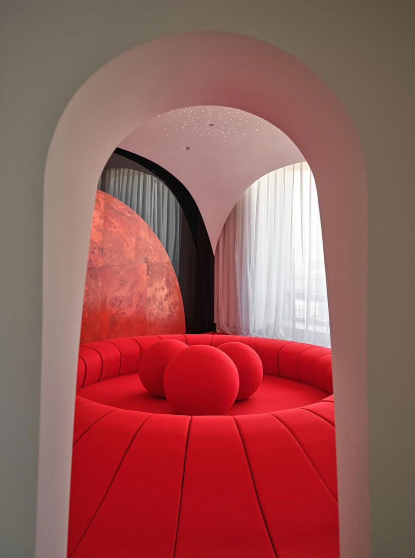 copper planet installation and red undulating seating anchor venus lounge by asap/ in beijing