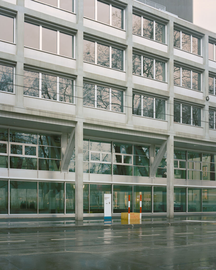 elevated concrete truss frame forms vocational school for construction trades in zurich