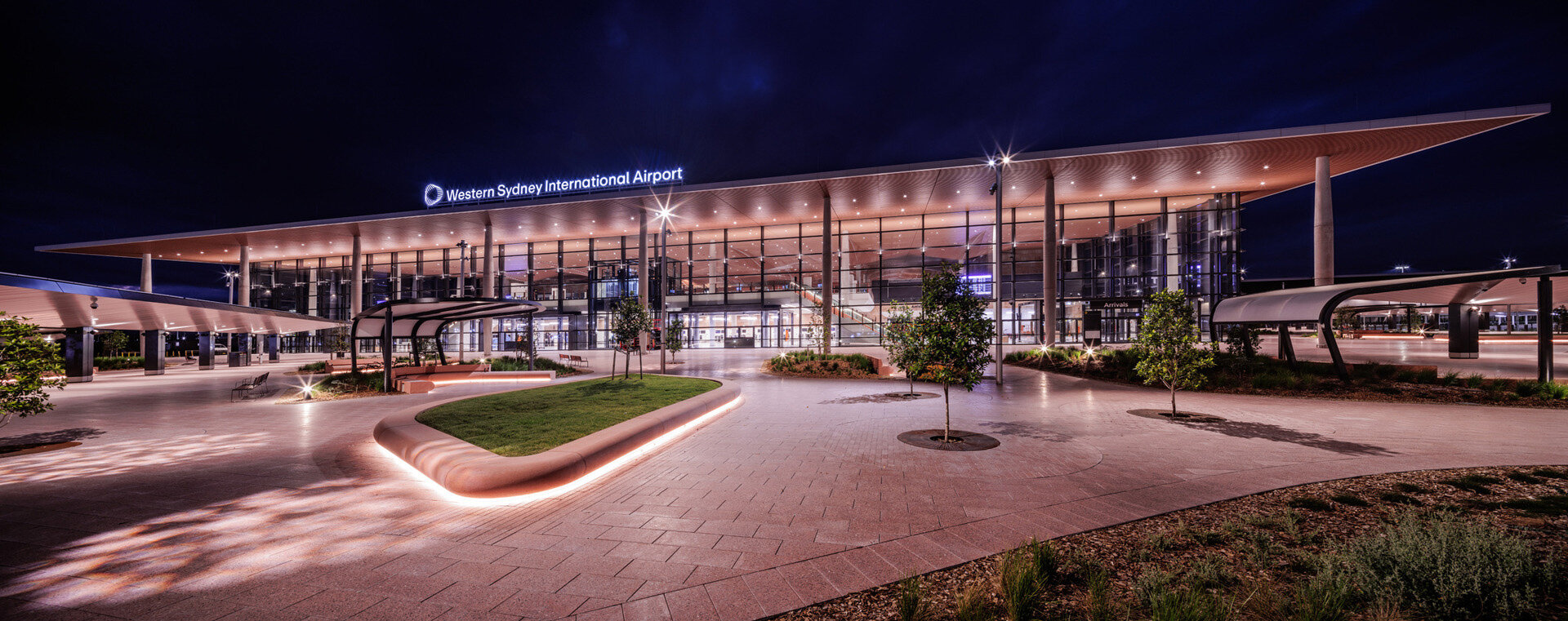 ZHA, COX & woods bagot shape sydney airport terminal with wavy timber-toned modules