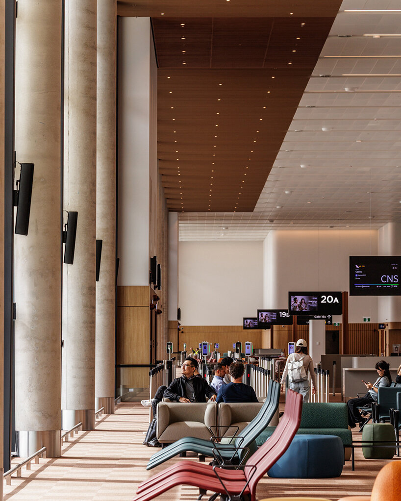 ZHA, COX & woods bagot shape sydney airport terminal with wavy timber-toned modules