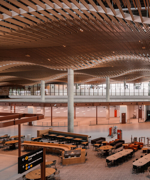 ZHA, COX & woods bagot shape sydney airport terminal with wavy timber-toned modules