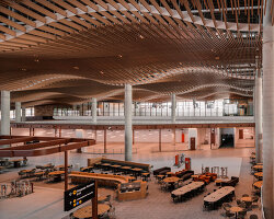 ZHA, COX & woods bagot shape sydney airport terminal with wavy timber-toned modules