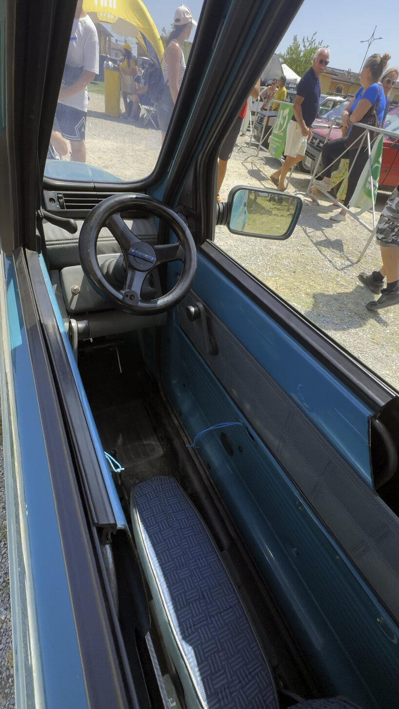 inside, there's a small steering wheel