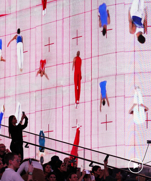 leaping olympic gymnasts form shifting colorfield in yuge zhou's NYC times square takeover