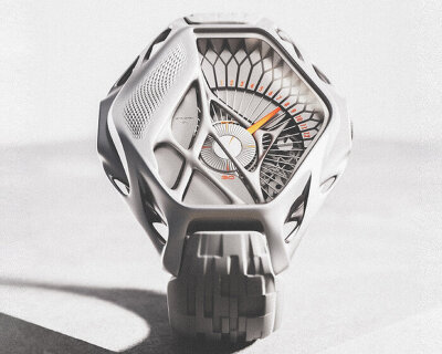 3D printed titanium watch STRACTRA places the hours over geometric, 180-degree arc