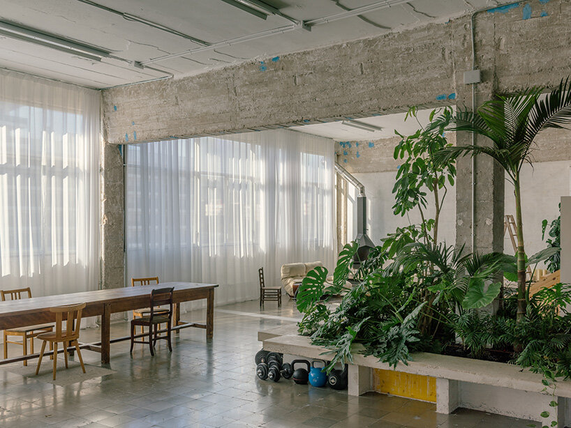 atienza maure converts barcelona warehouse into live-work space using industrial systems