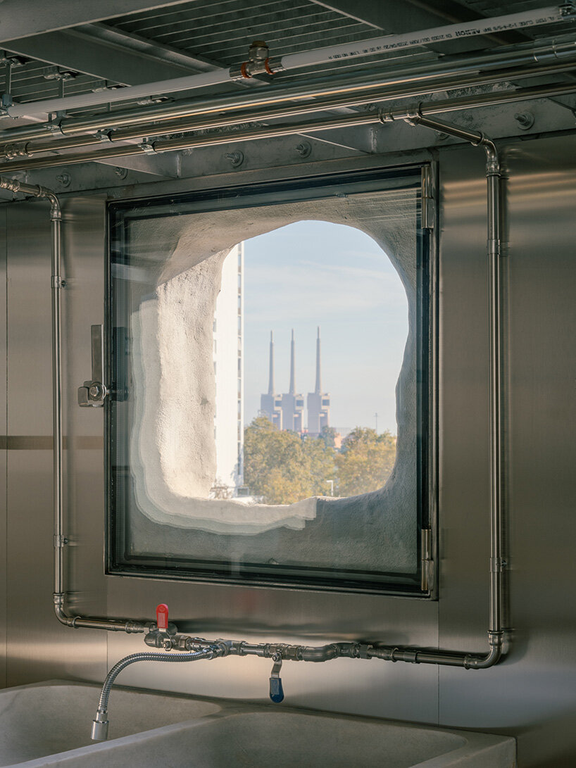 atienza maure converts barcelona warehouse into live-work space using industrial systems