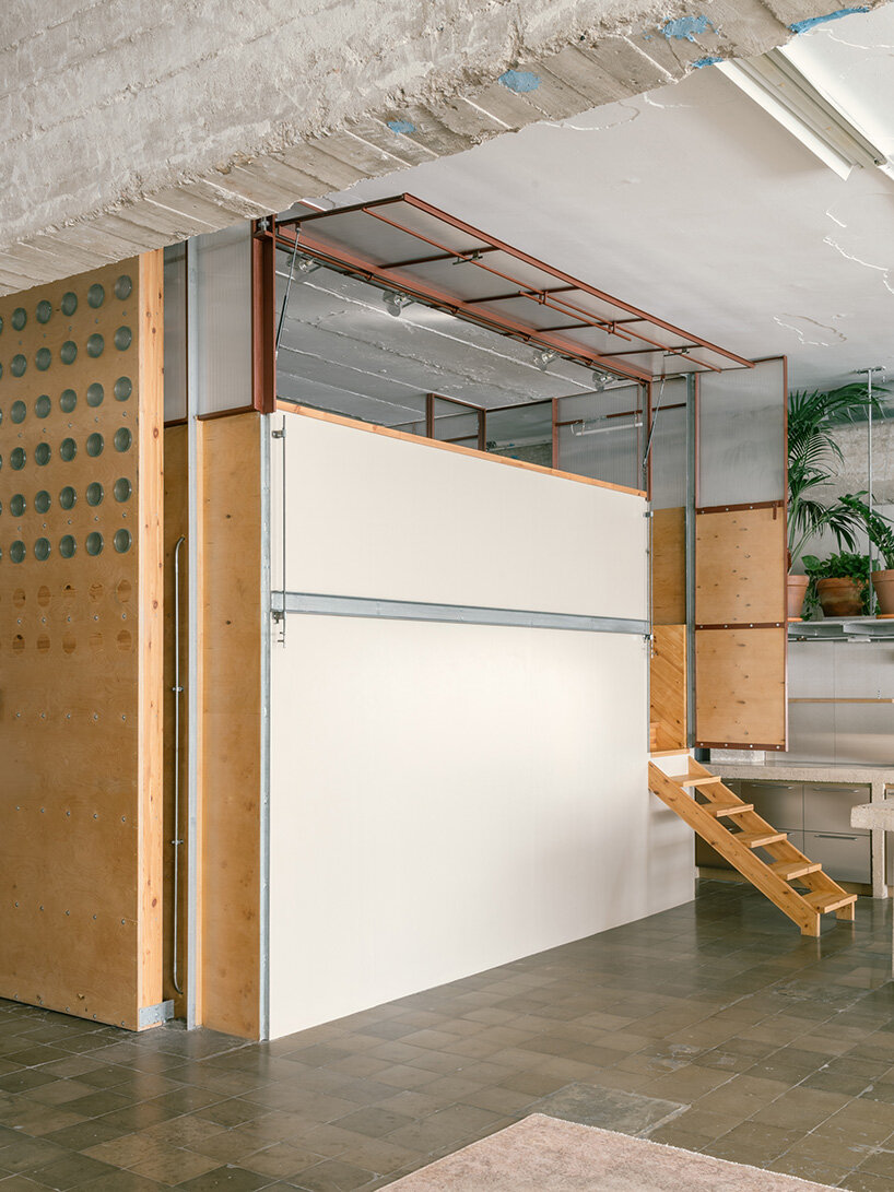 atienza maure converts barcelona warehouse into live-work space using industrial systems