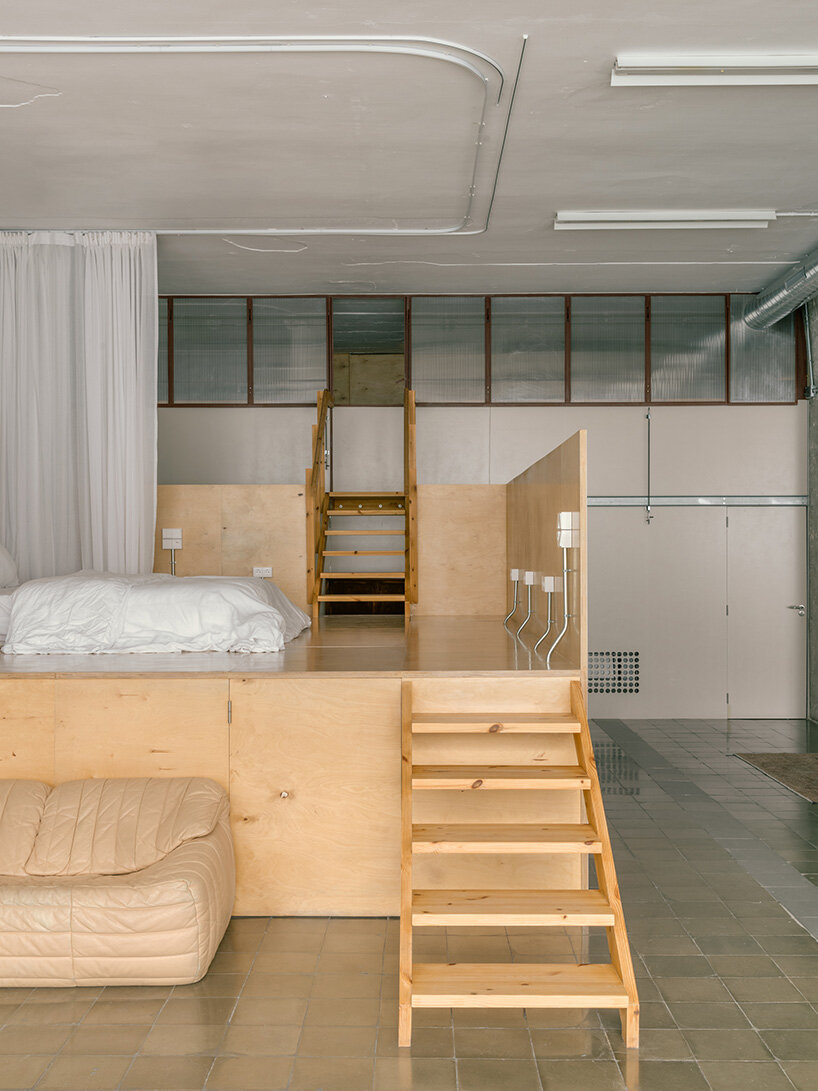 atienza maure converts barcelona warehouse into live-work space using industrial systems