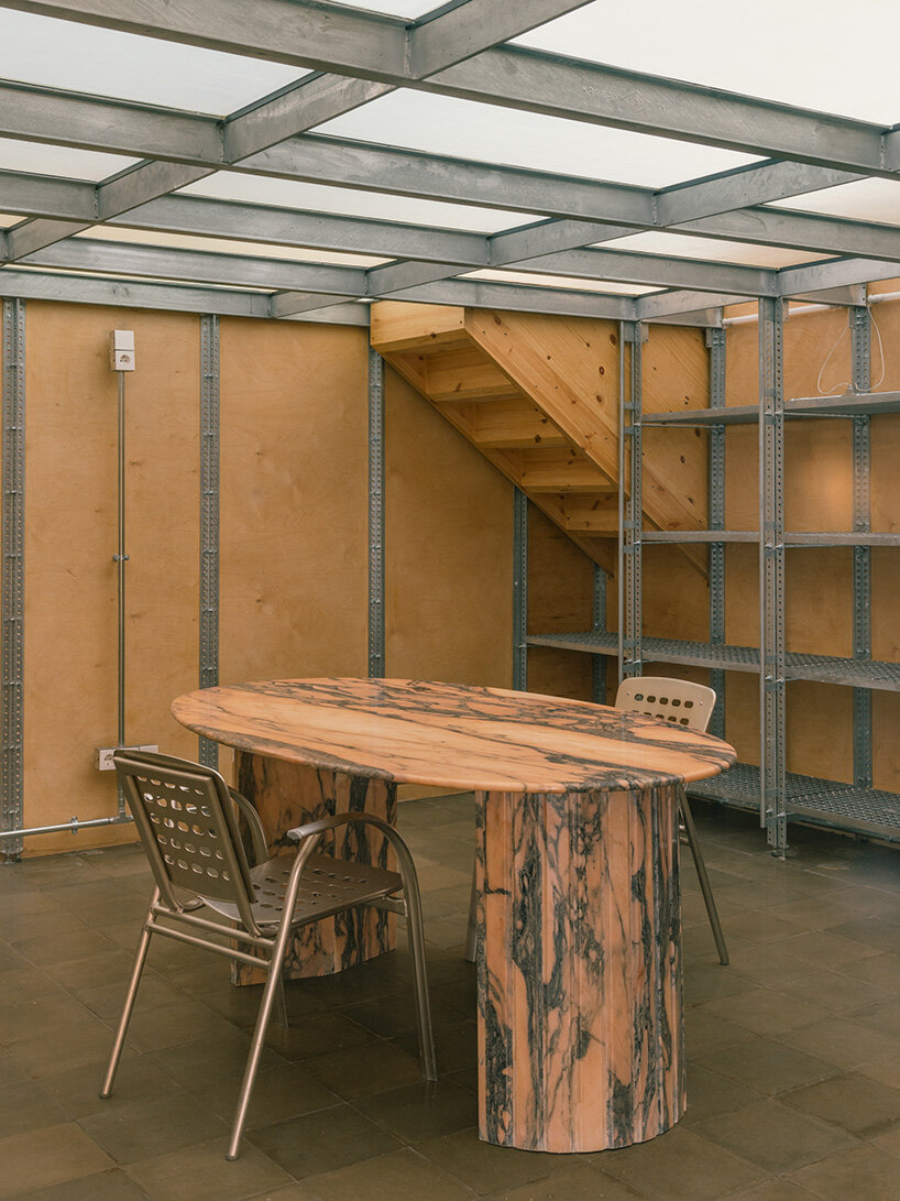 atienza maure converts barcelona warehouse into live-work space using industrial systems