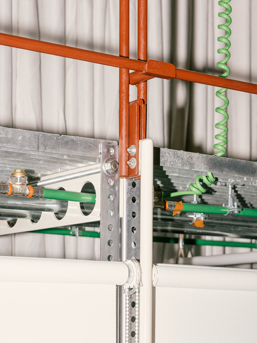 atienza maure converts barcelona warehouse into live-work space using industrial systems