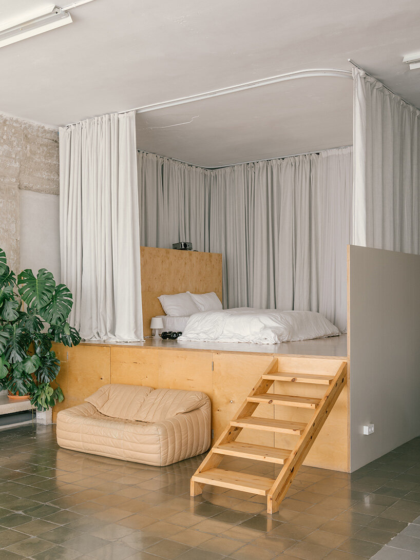 atienza maure converts barcelona warehouse into live-work space using industrial systems