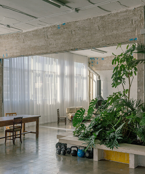 atienza maure converts barcelona warehouse into live-work space using industrial systems
