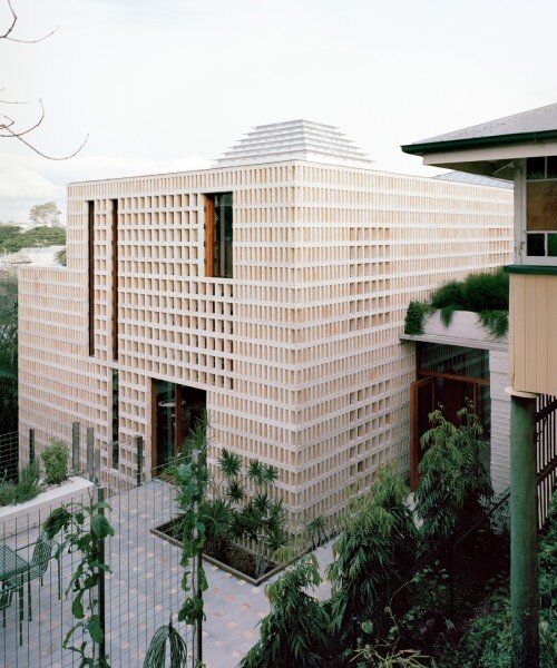salvaged terracotta & metal nets enclose peter besley's ziggurat-topped australian house