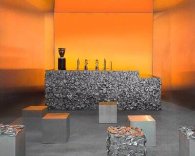 warm orange glow bathes crosby studios' chromatic café nuances in paris 