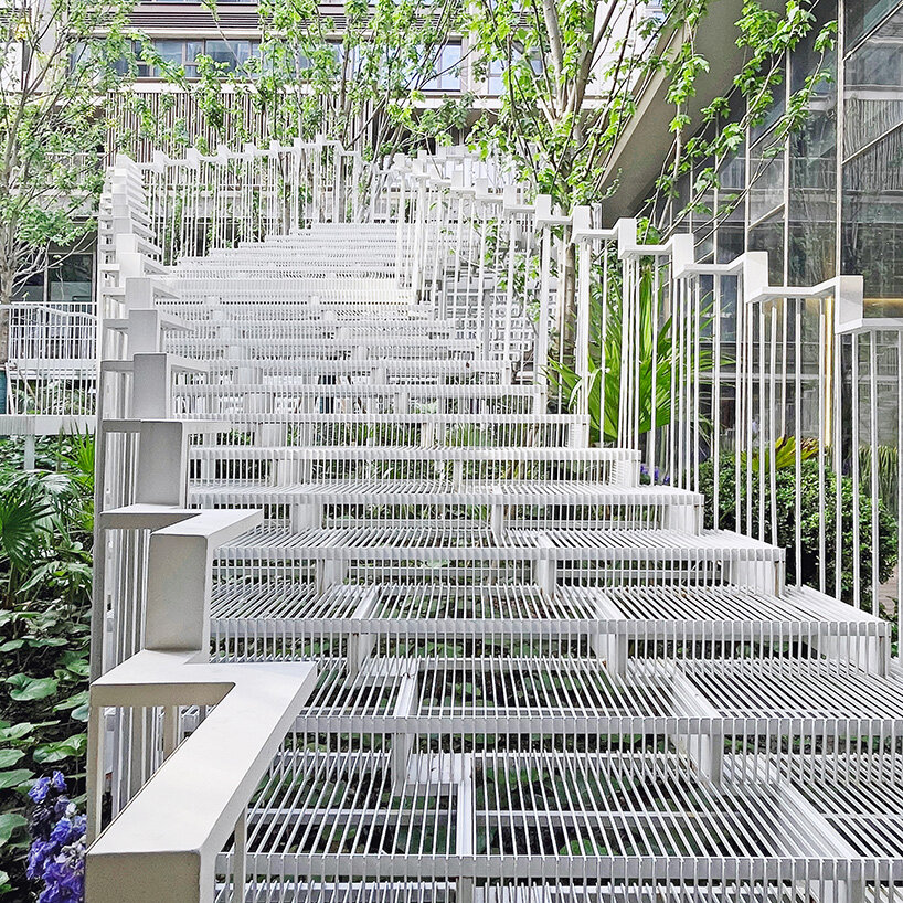 cascading staircase threads through sunken courtyard by TROP at shanghai residence