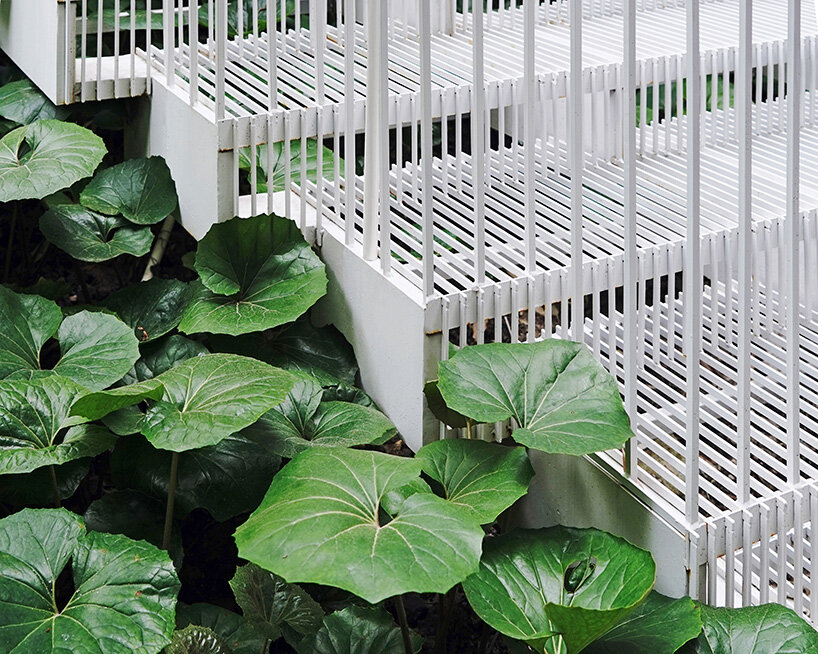 cascading staircase threads through sunken courtyard by TROP at shanghai residence