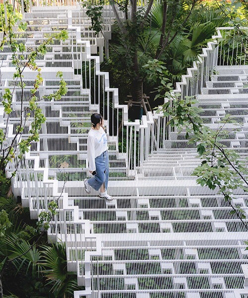 cascading staircase threads through sunken courtyard by TROP at shanghai residence