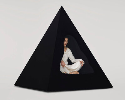 pyramidal cave chair by domain architects for bischiyano shapes retreat for secluded comfort