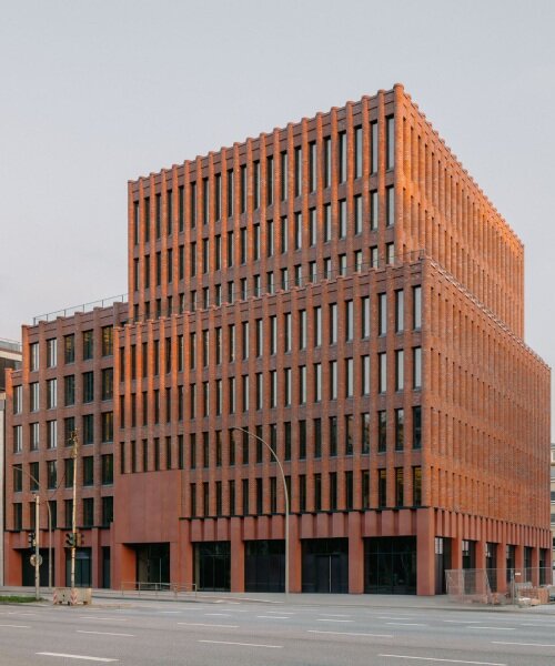 semi-circular brick columns clad christ & gantenbein's hamburg complex in rhythmic pattern