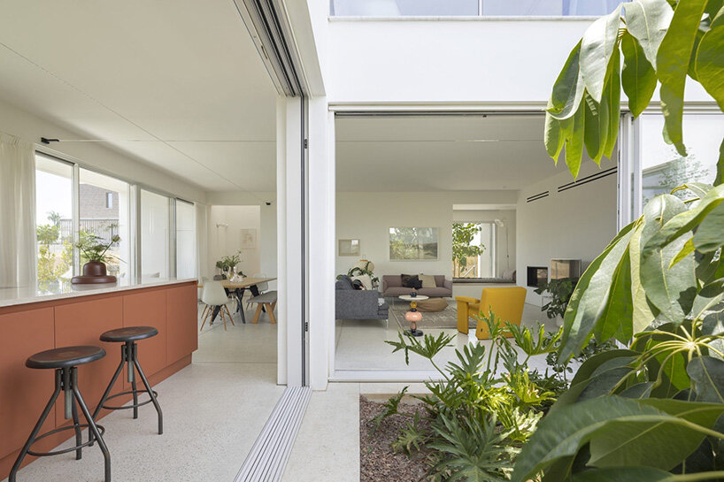 concentric white walls envelop garden-filled residence by draftworks* architects in cyprus