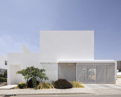 concentric white walls envelop garden-filled residence by draftworks* architects in cyprus