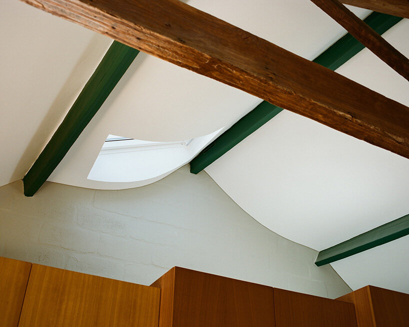cork-clad house in portugal gets upside-down layout through atelier local's redesign