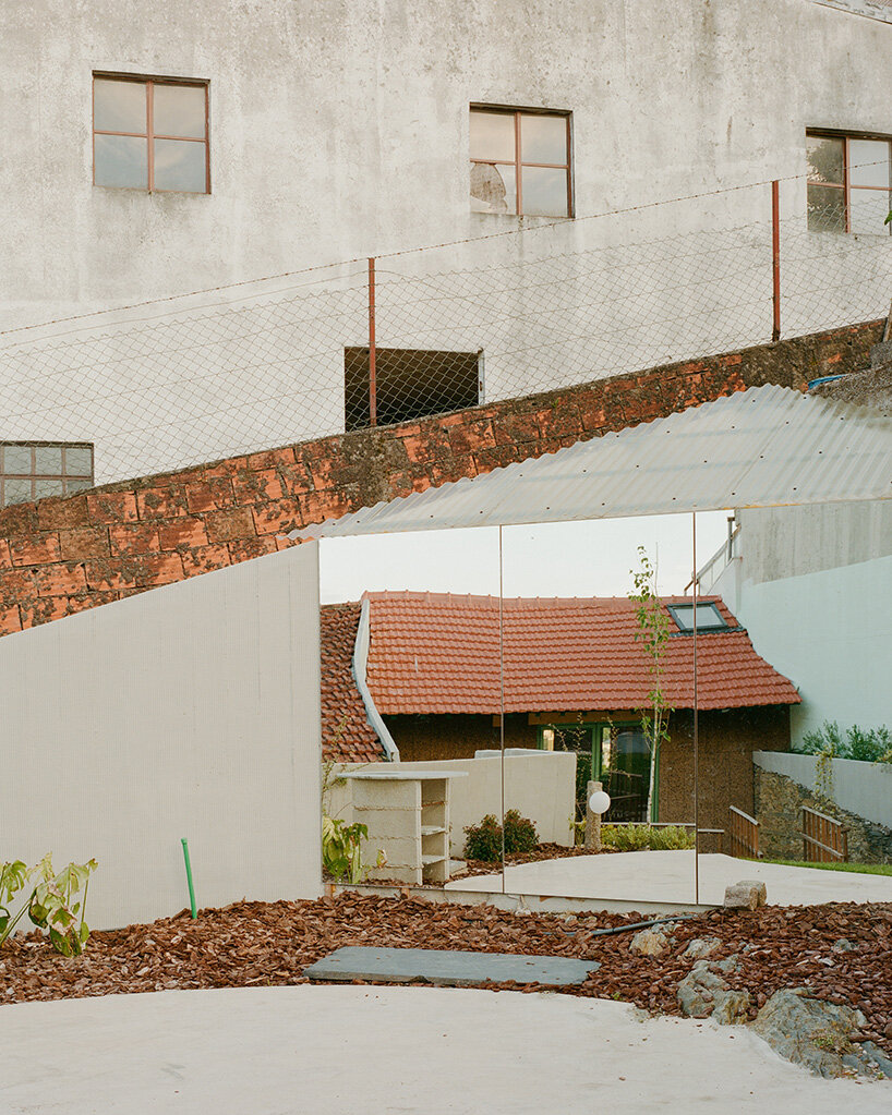 cork-clad house in portugal gets upside-down layout through atelier local's redesign