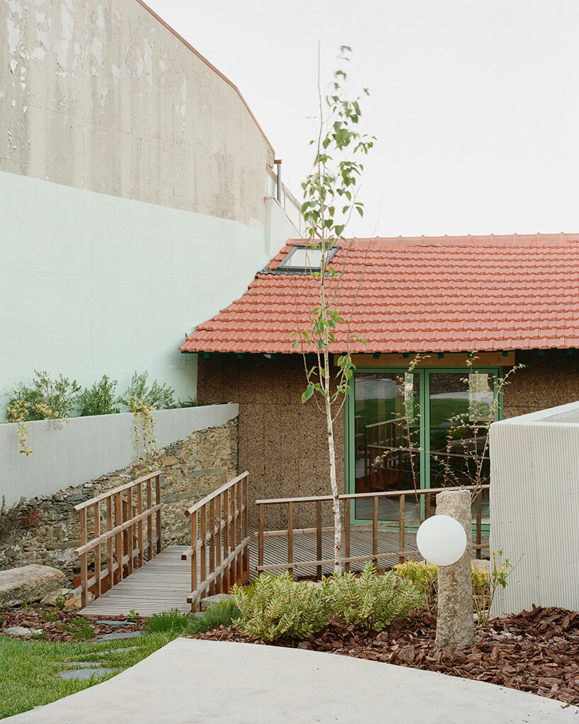 cork-clad house in portugal gets upside-down layout through atelier local's redesign