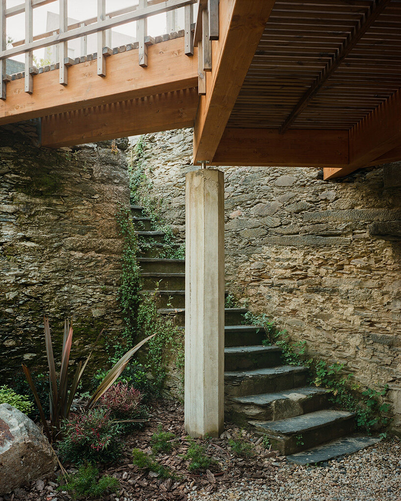 cork-clad house in portugal gets upside-down layout through atelier local's redesign