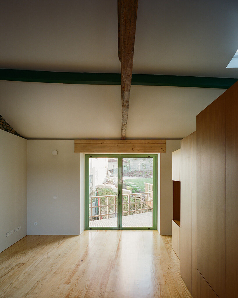 cork-clad house in portugal gets upside-down layout through atelier local's redesign