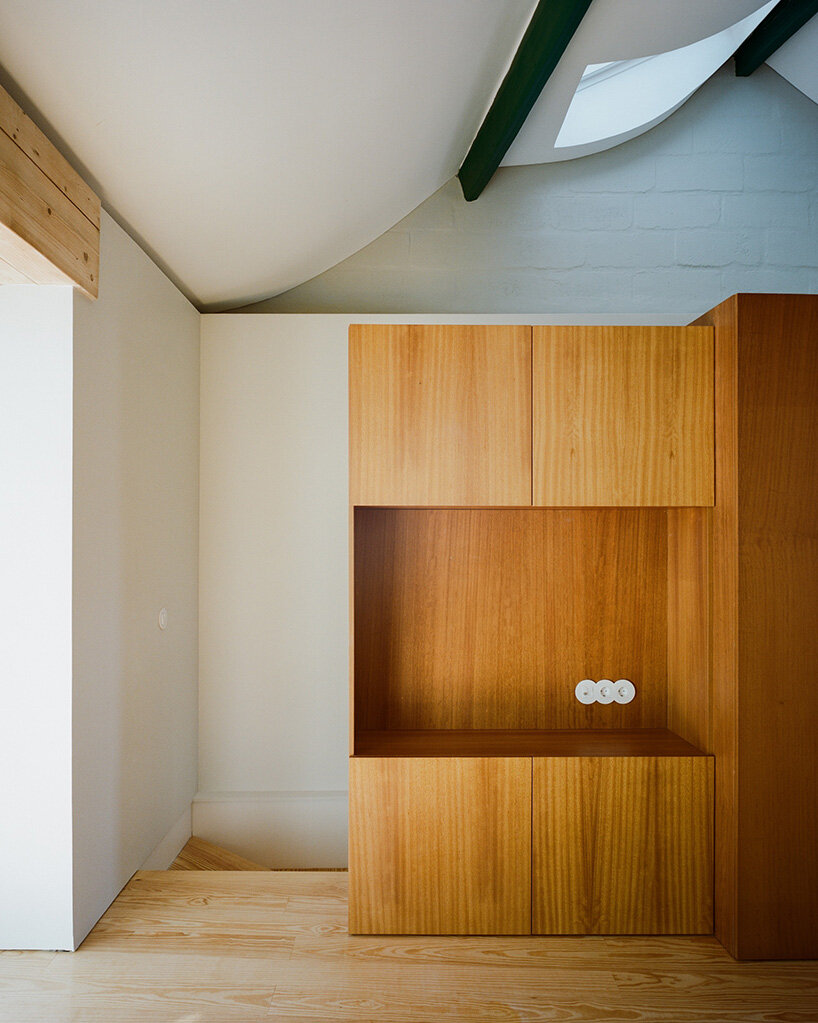 cork-clad house in portugal gets upside-down layout through atelier local's redesign