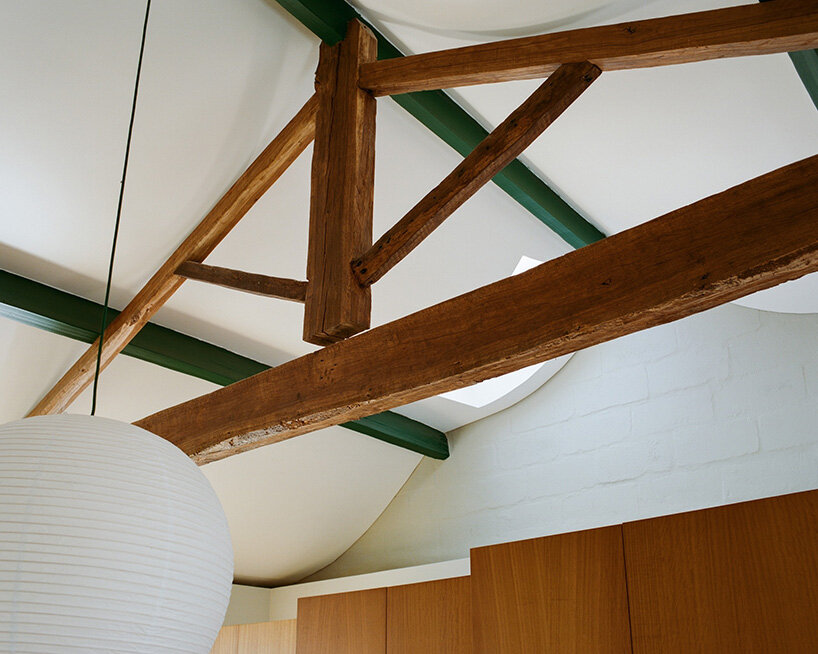 cork-clad house in portugal gets upside-down layout through atelier local's redesign