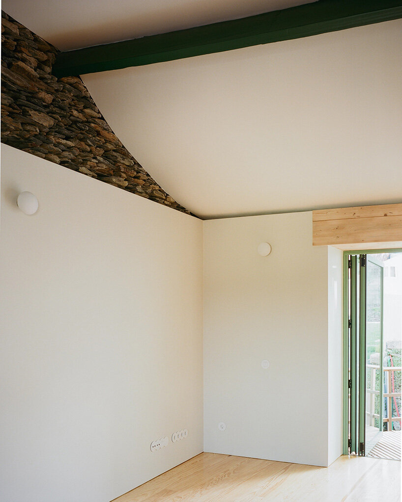 cork-clad house in portugal gets upside-down layout through atelier local's redesign