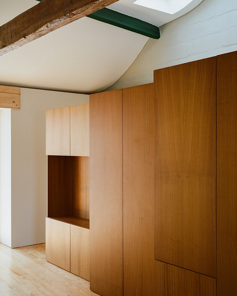 cork-clad house in portugal gets upside-down layout through atelier local's redesign