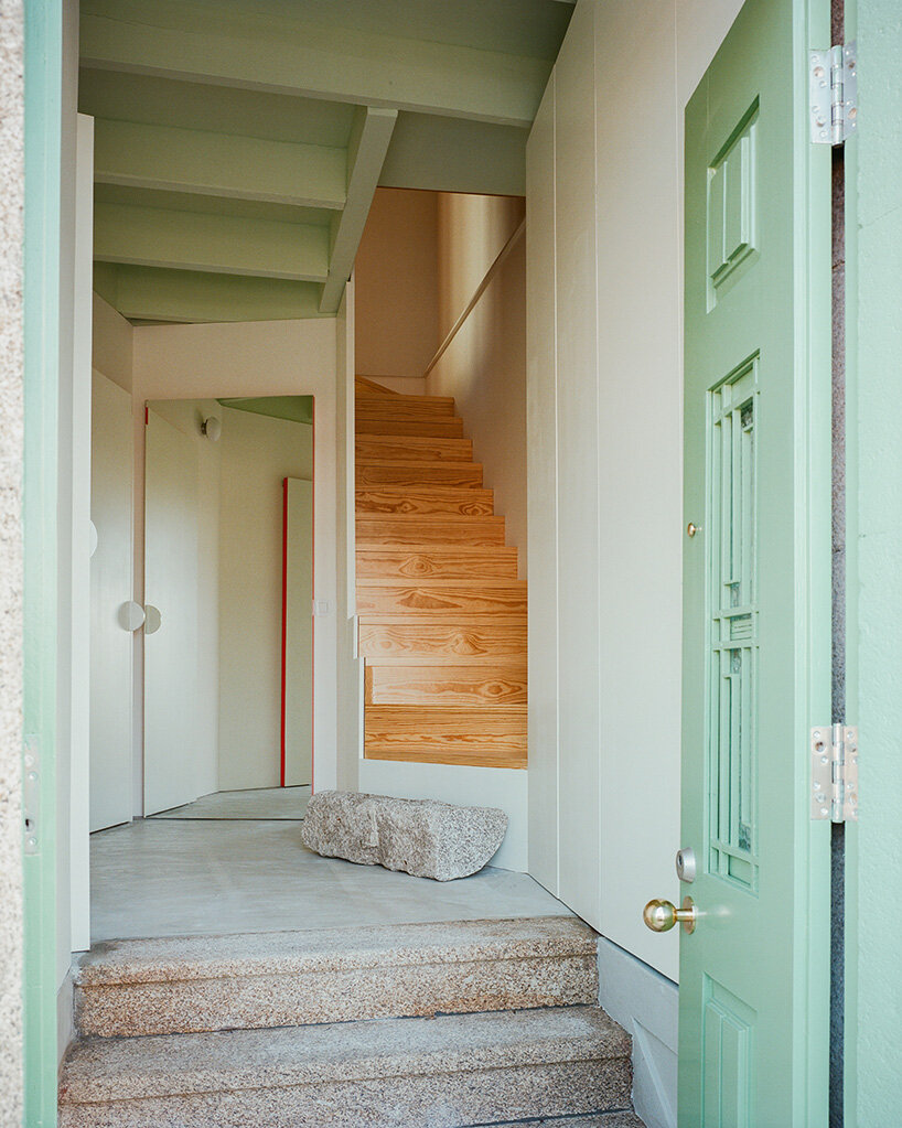 cork-clad house in portugal gets upside-down layout through atelier local's redesign
