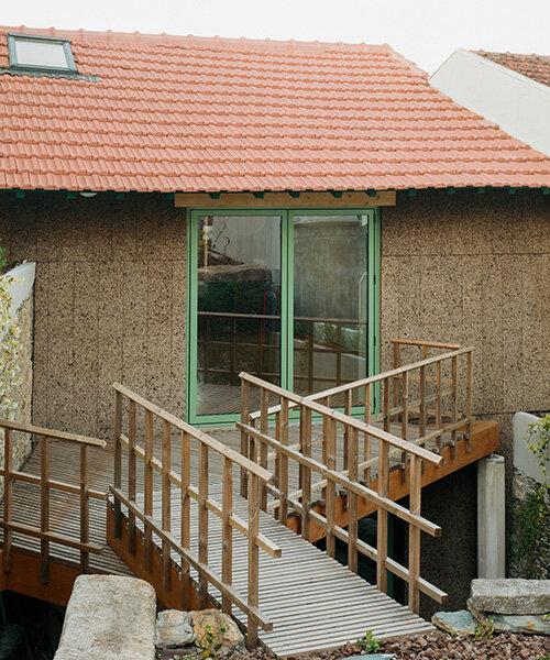 cork-clad house in portugal gets upside-down layout through atelier local's redesign