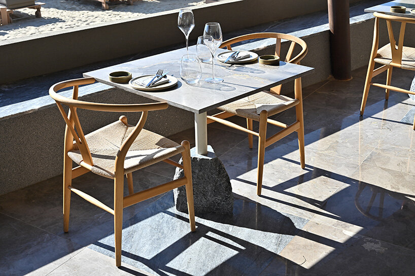 CTRLZAK channels filtered forest light in pine-inspired restaurant at ekies resort, greece