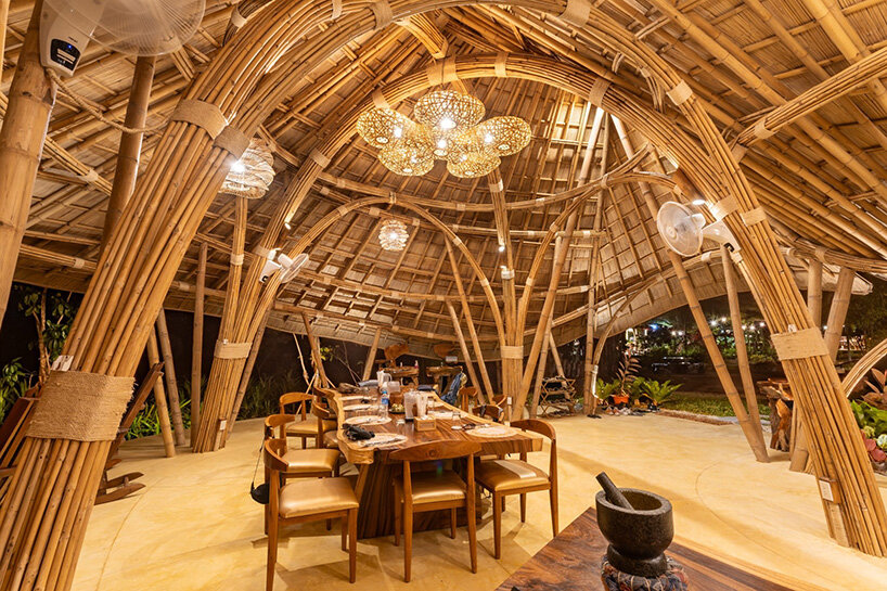 curved edges rise to form bull-like bamboo pavilion by chiangmai life architects in thailand