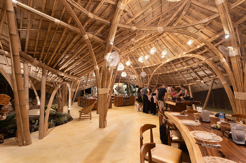 curved edges rise to form bull-like bamboo pavilion by chiangmai life architects in thailand