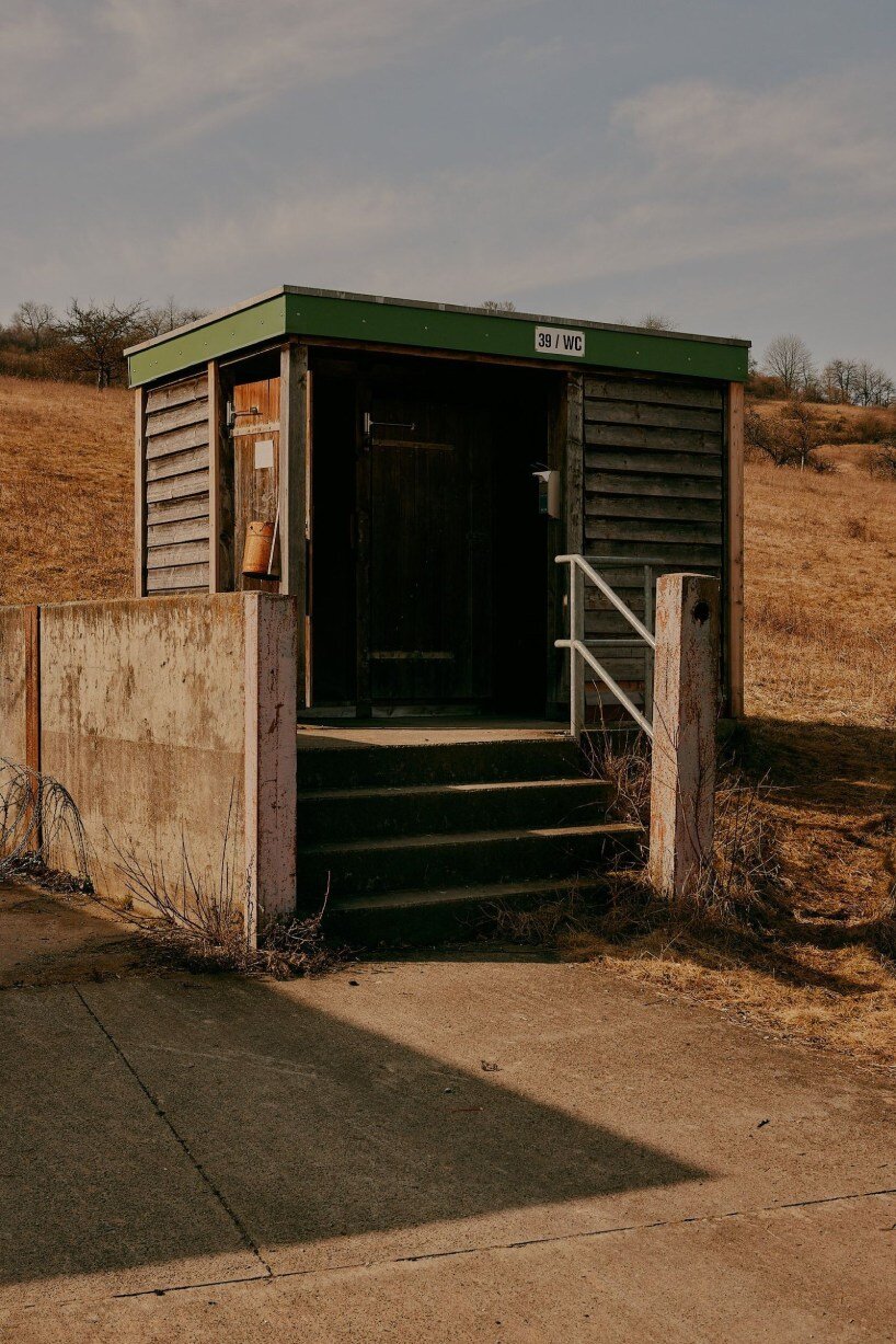 david altrath captures eerie stillness of bonnland, an abandoned military village in germany