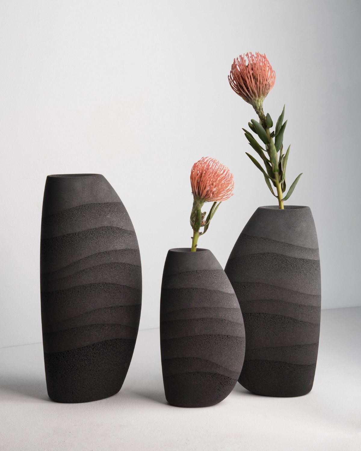 karim+elias give desert sand new form with luminous wall lamps and sculptural vases