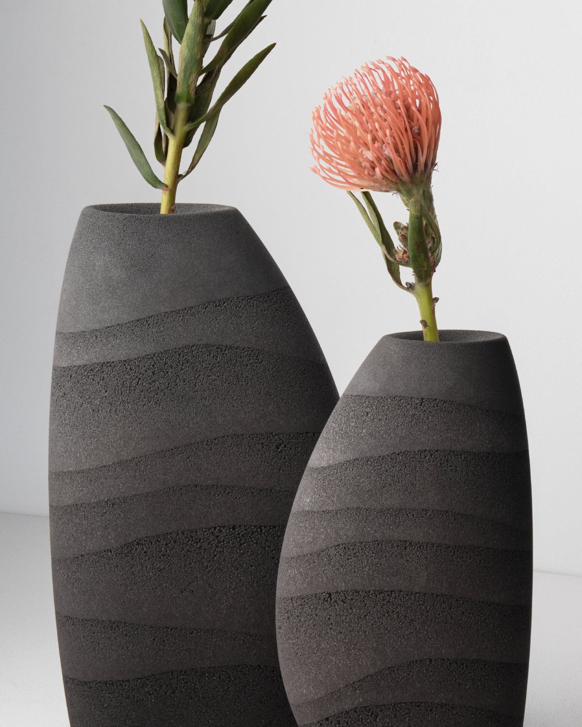 karim+elias give desert sand new form with luminous wall lamps and sculptural vases