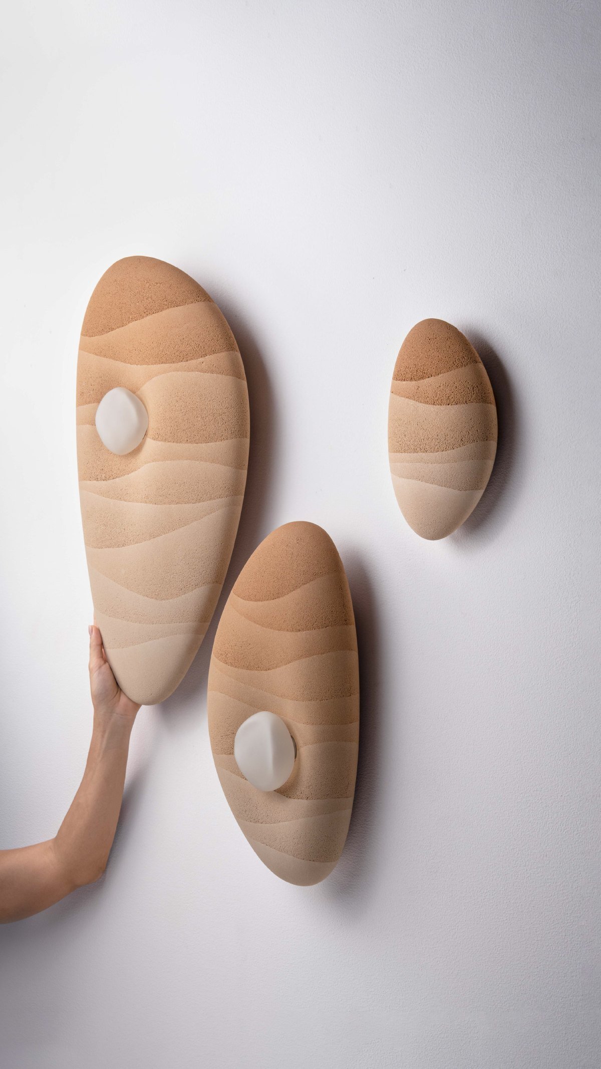 karim+elias give desert sand new form with luminous wall lamps and sculptural vases