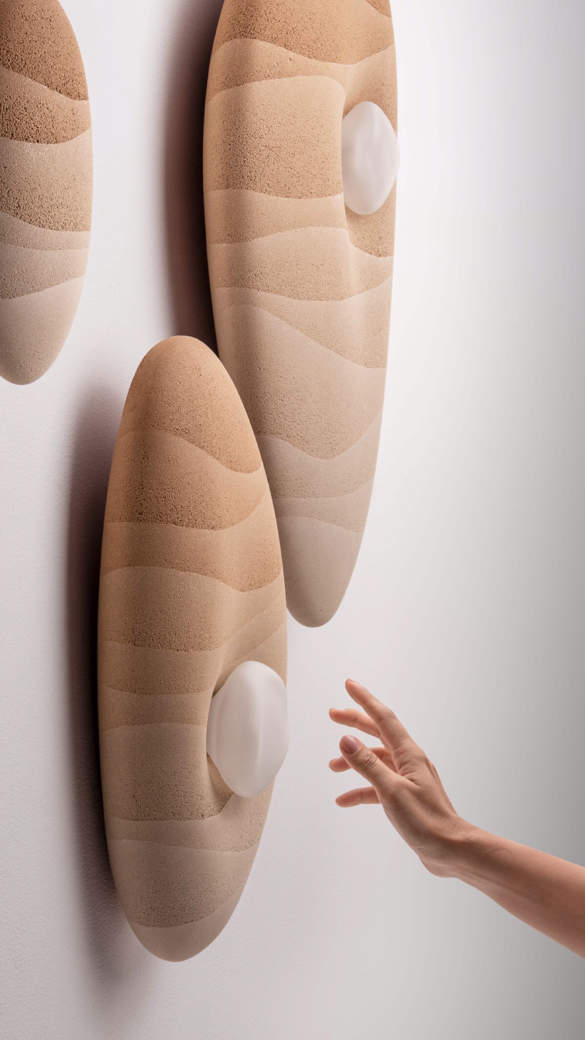 karim+elias give desert sand new form with luminous wall lamps and sculptural vases