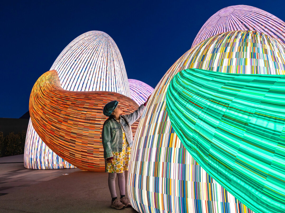 ENESS' glowing, interactive AI oracles question digital futures near new zealand mountains