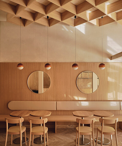 gridded ceiling tops zooco estudio's oak and travertine regma ice cream parlor