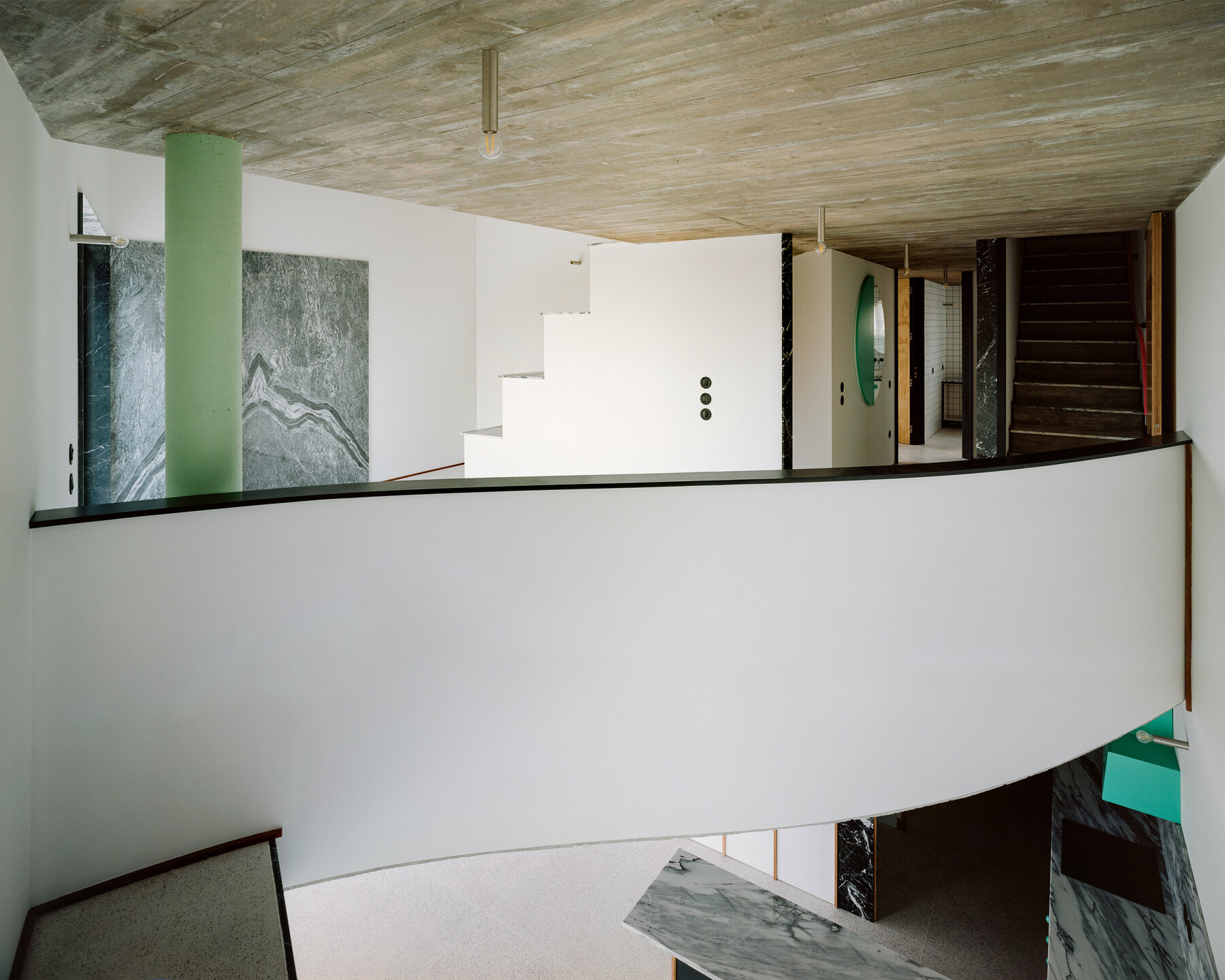 -fala-atelier-sloped-roof-slant-curves-sculptural-home-portugal-designboom-large