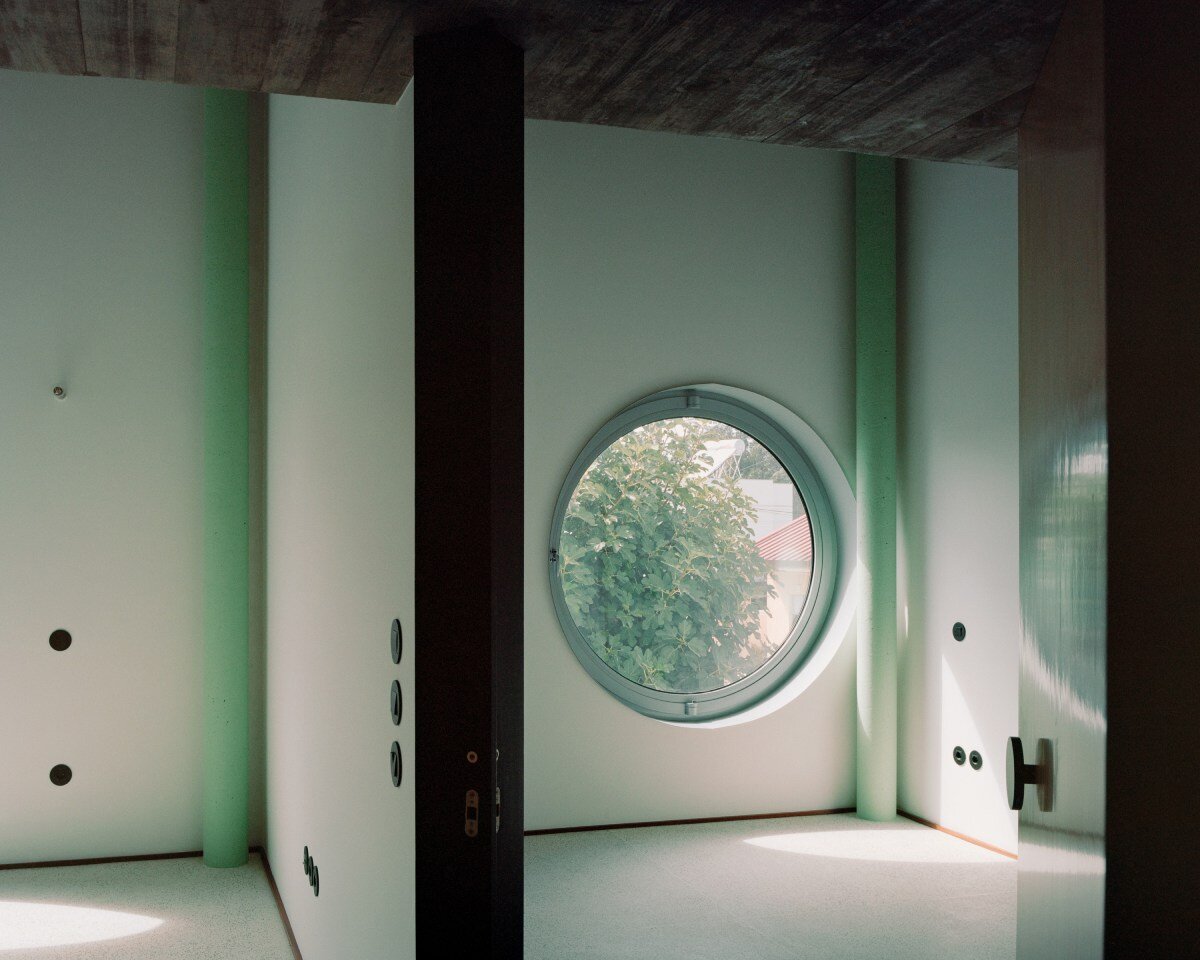 fala atelier inverts the sloped roof with slants and curves for this sculptural home in portugal