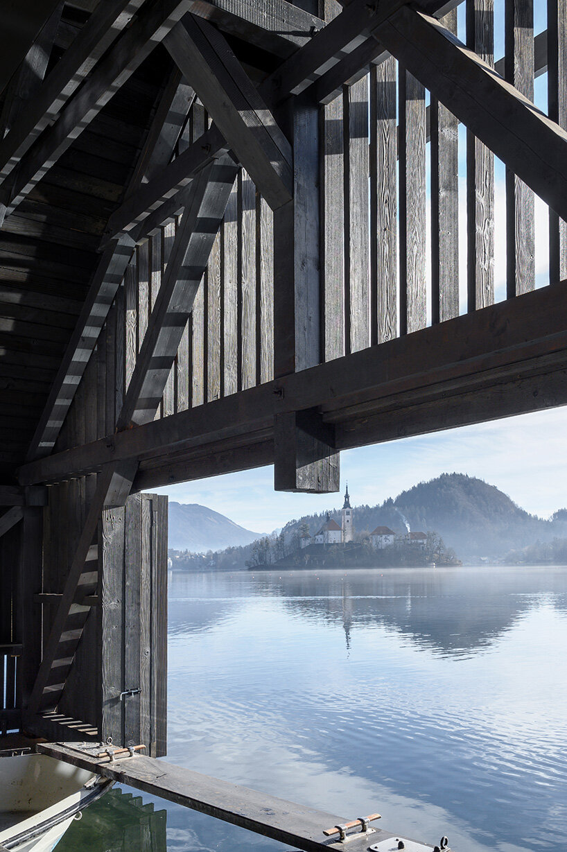 OFIS architects renovates boathouse in slovenia with rooftop garden that filters lake water
